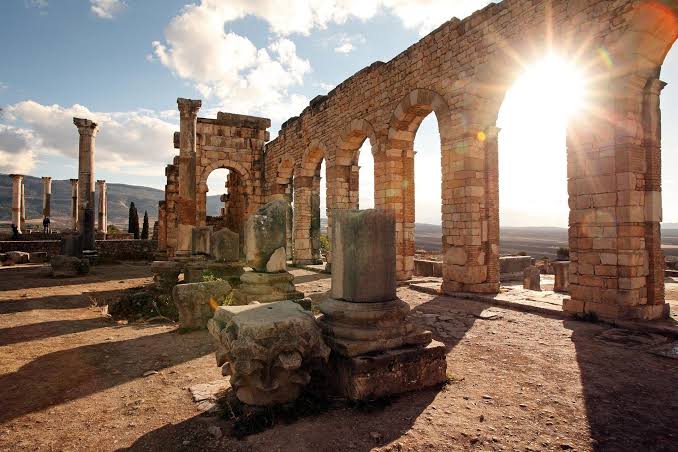The Roman ruins of Volubilis at sunrise near Meknes, Morocco — the ancient capital of the Amazigh kingdom of Mauretania Tingitana